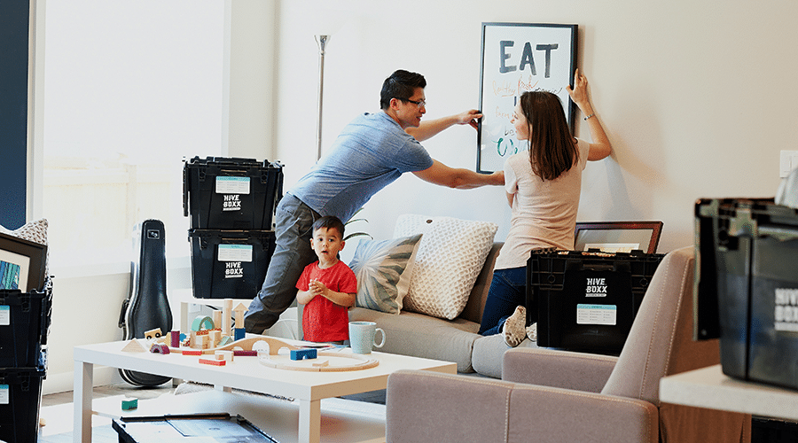 Happy family decorating their apartment.